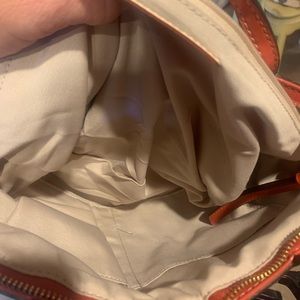 NWOT Coach Purse. Beautiful color and inside is in great condition.